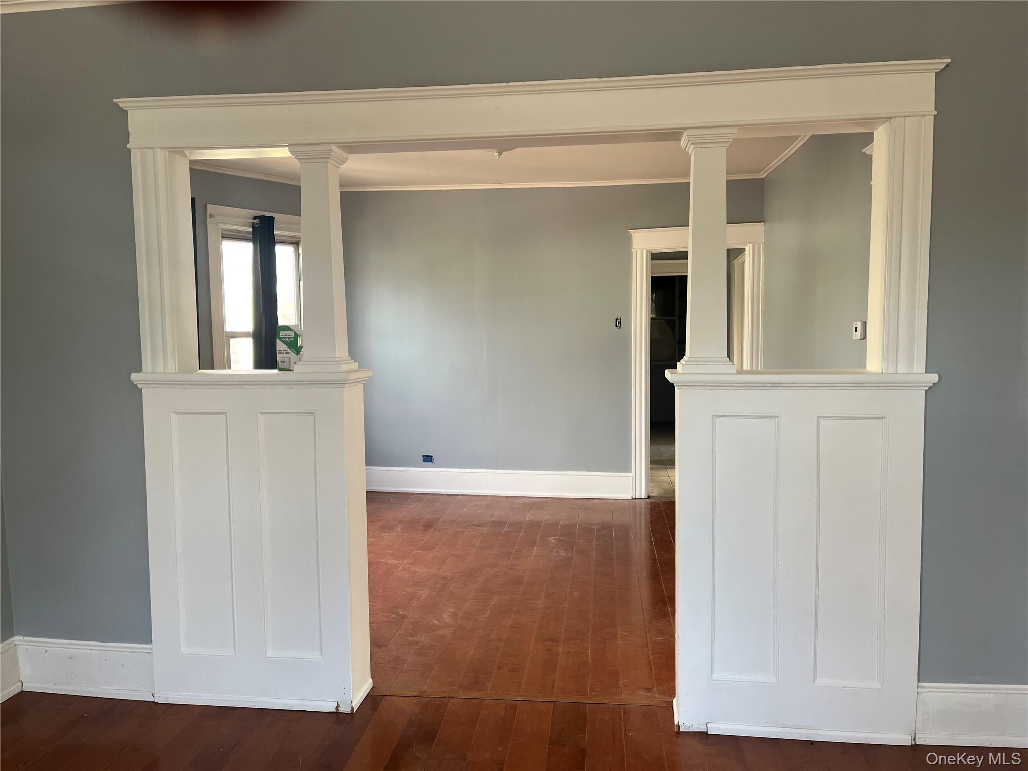 107 Smith Street, Unit 2 Poughkeepsie, NY 12601 - Photo 4 of 9 wooden floor and window