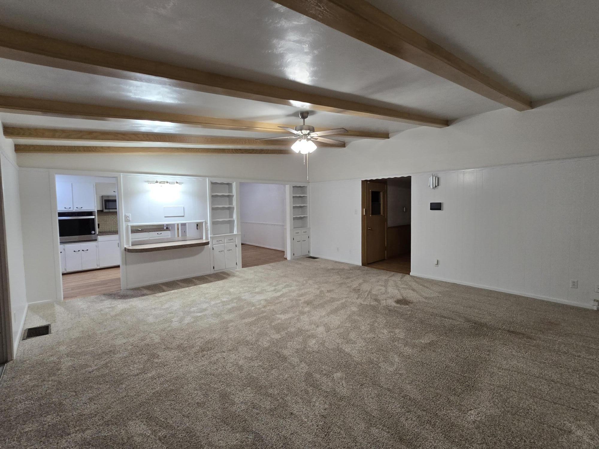 2229 South 6th Street Lamesa, TX 79331 - Photo 8 of 27 an empty room with a empty space and windows