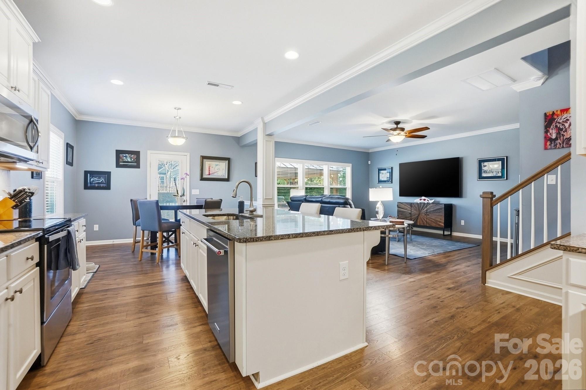 1103 Clover Lane Matthews, NC 28104 - Photo 12 of 46 a living room with stainless steel appliances granite countertop lots of counter top space and a window