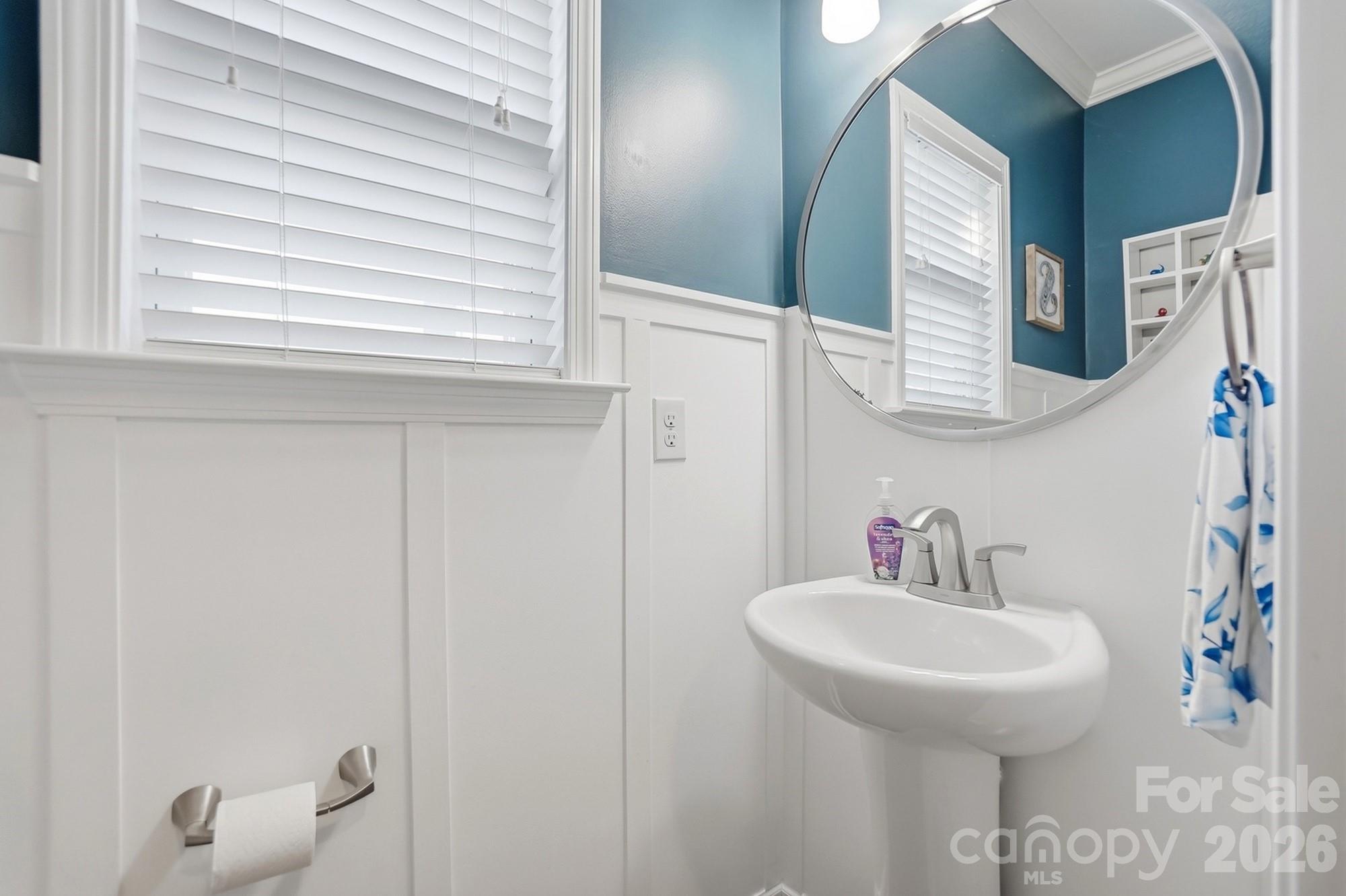 1103 Clover Lane Matthews, NC 28104 - Photo 23 of 46 a bathroom with a sink and a mirror