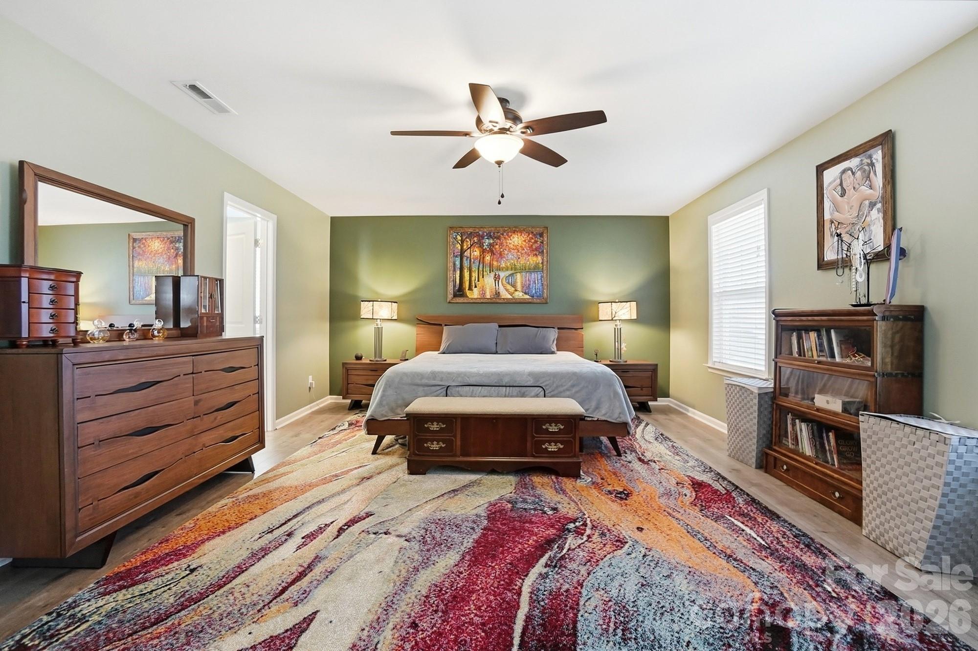 1103 Clover Lane Matthews, NC 28104 - Photo 25 of 46 a bedroom with a bed and furniture