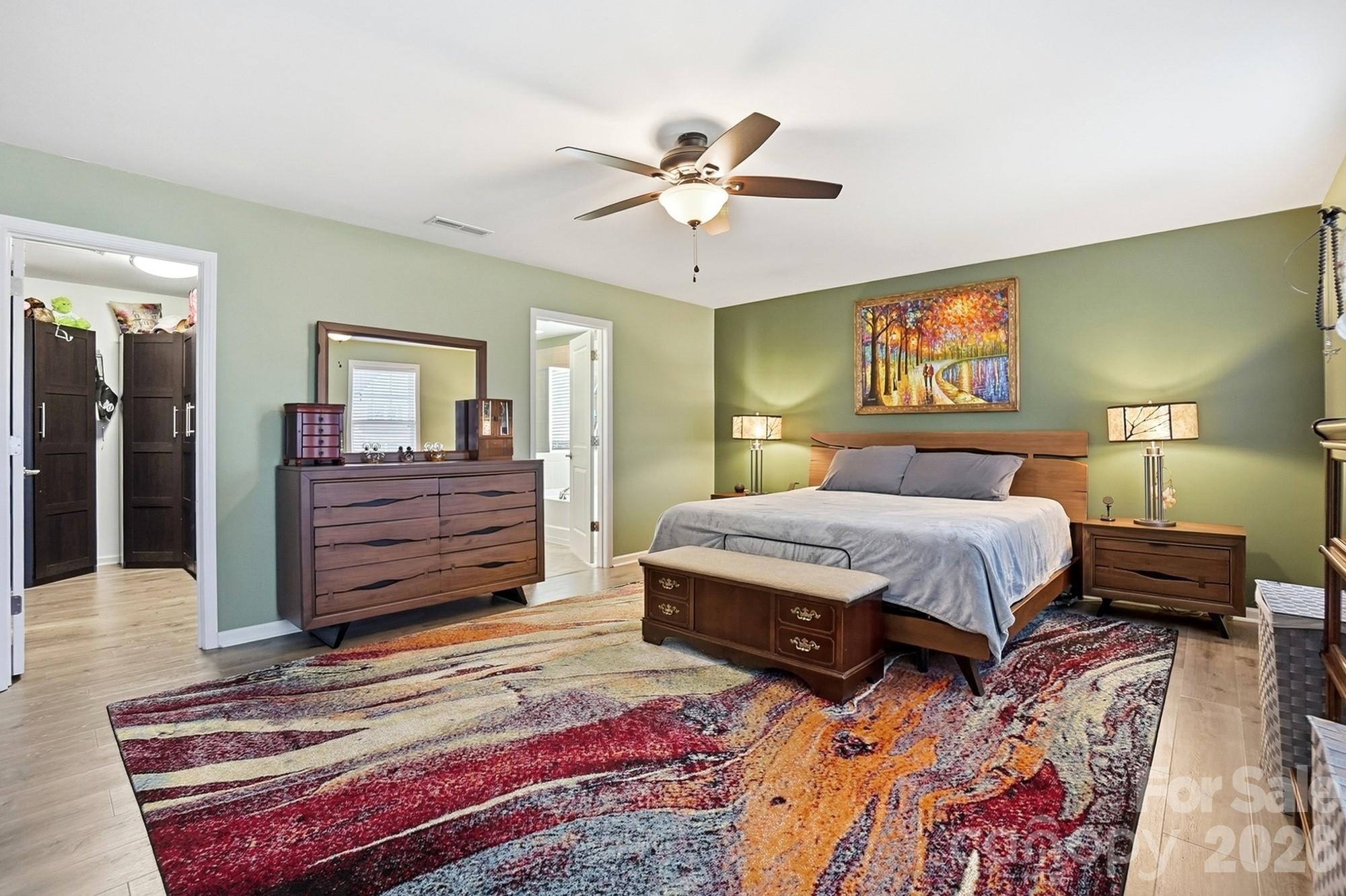 1103 Clover Lane Matthews, NC 28104 - Photo 26 of 46 a bedroom with a bed and dresser