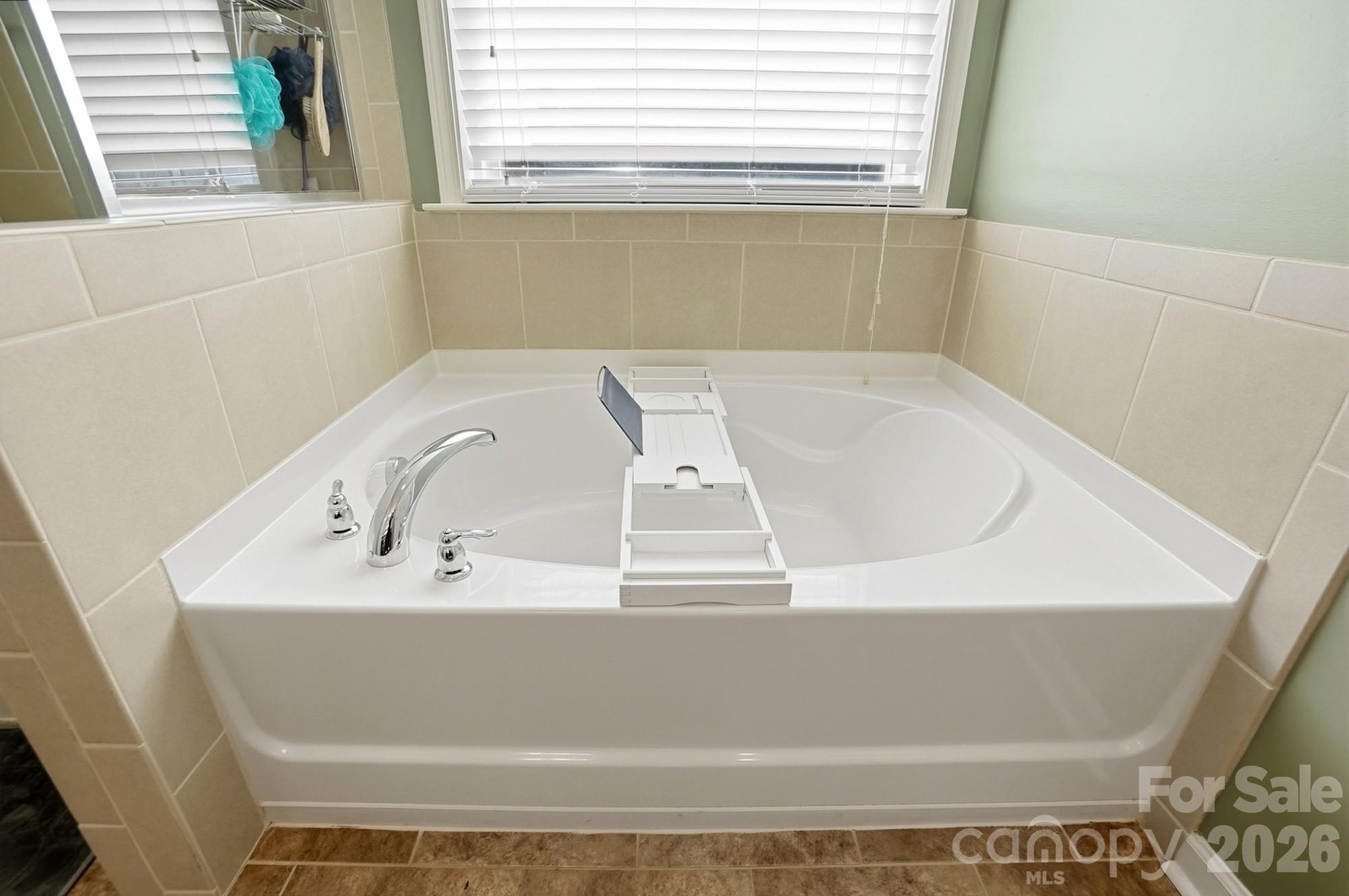 1103 Clover Lane Matthews, NC 28104 - Photo 31 of 46 a bathroom with a bathtub
