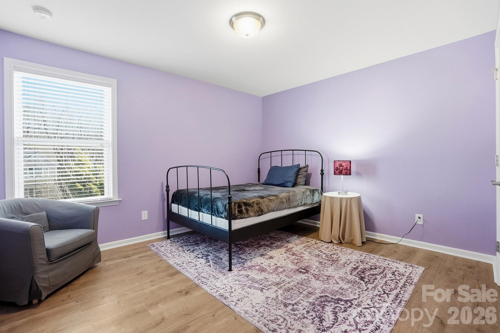 1103 Clover Lane Matthews, NC 28104 - Photo 40 of 46 a bedroom with a bed and a couch