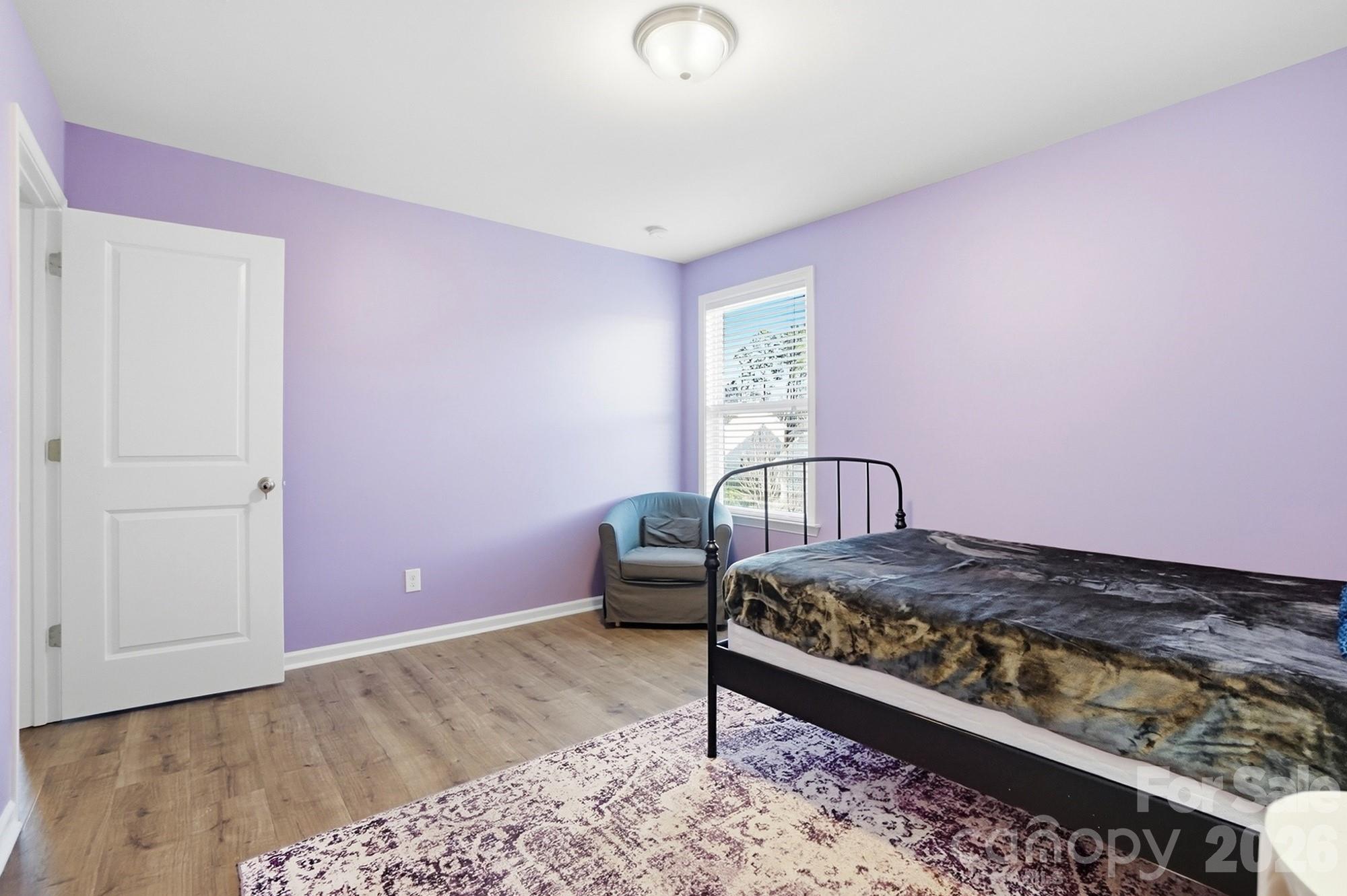 1103 Clover Lane Matthews, NC 28104 - Photo 41 of 46 a bedroom with a bed and a dresser