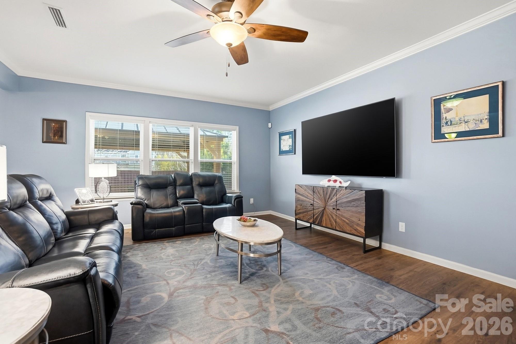 1103 Clover Lane Matthews, NC 28104 - Photo 5 of 46 a living room with furniture and a flat screen tv