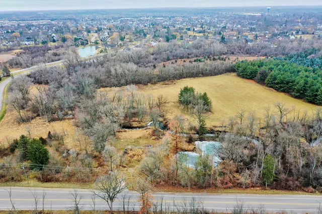 a view of a swimming pool with a yard