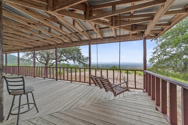 a view of deck with wooden floor and outdoor seating