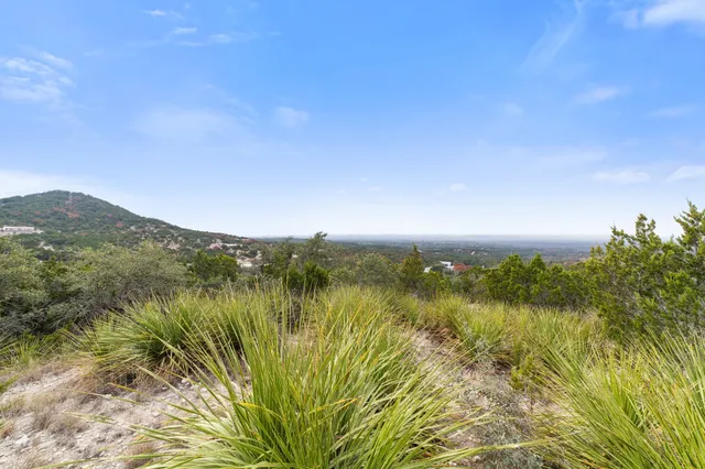 a view of lake with green space