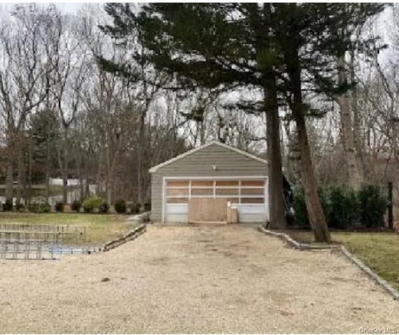 a view of open kitchen with furniture and floor to ceiling window