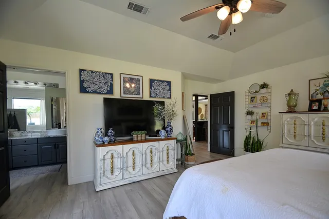 a bathroom with a double vanity sink and a mirror