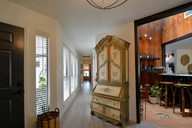 a bathroom with a granite countertop sink a toilet and mirror