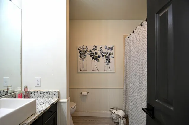 a view of a patio with table and chairs and potted plants