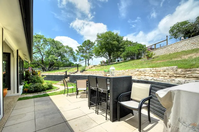 a view of a swimming pool with a patio