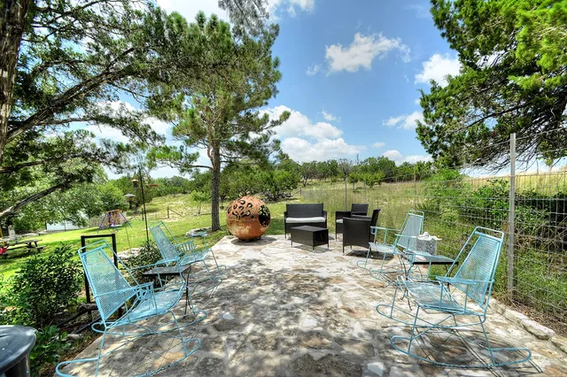 a view of backyard with green space