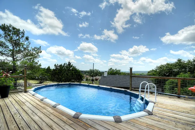 a view of a house with a backyard