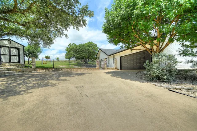 a view of a chairs and table in the patio