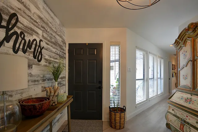 a living room with furniture fireplace and flat screen tv