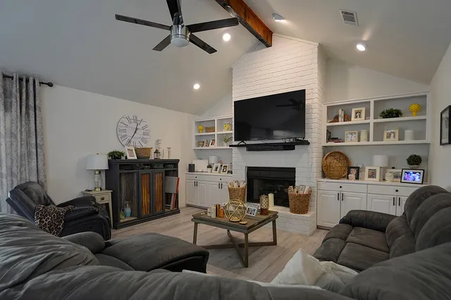 a living room with furniture and a large window