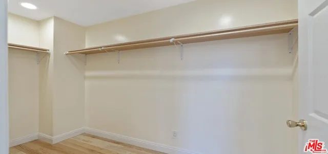 a view of an empty walk in closet