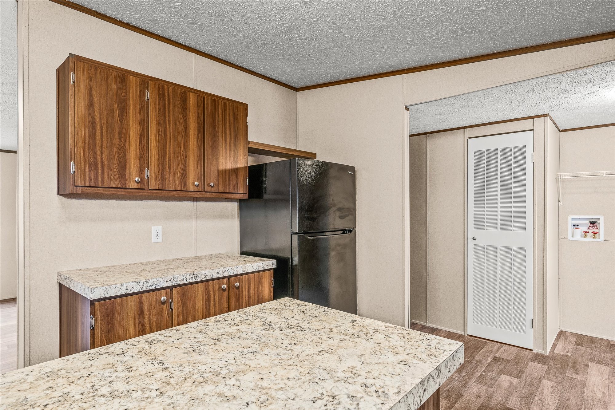 750 Maple Branch Road Sparta, TN 38583 - Photo 14 of 36 a kitchen with stainless steel appliances granite countertop a refrigerator stove top oven and sink