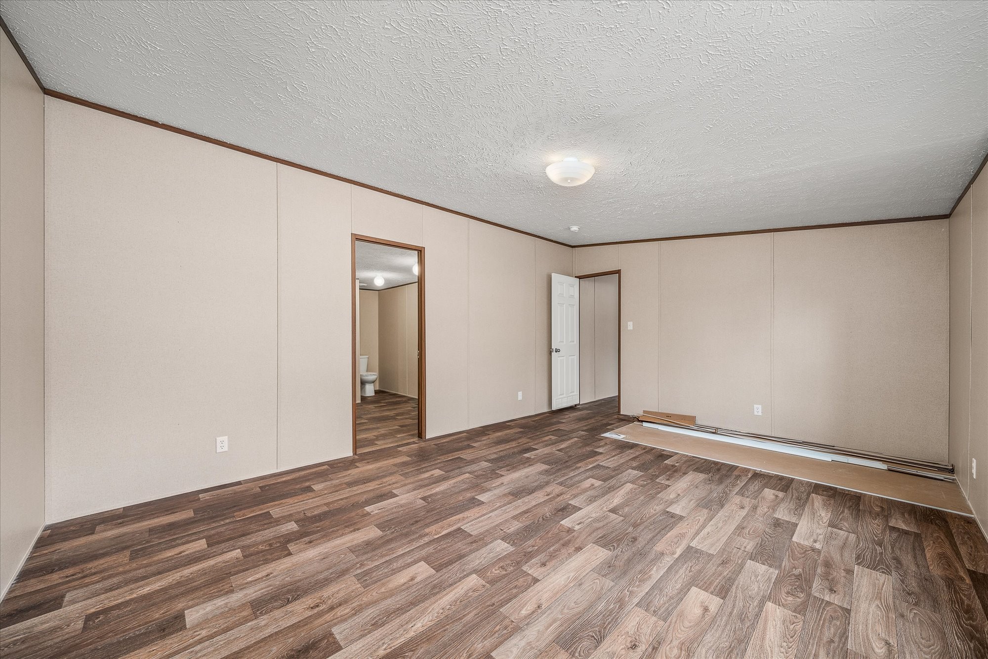 750 Maple Branch Road Sparta, TN 38583 - Photo 17 of 36 a view of an empty room with wooden floor