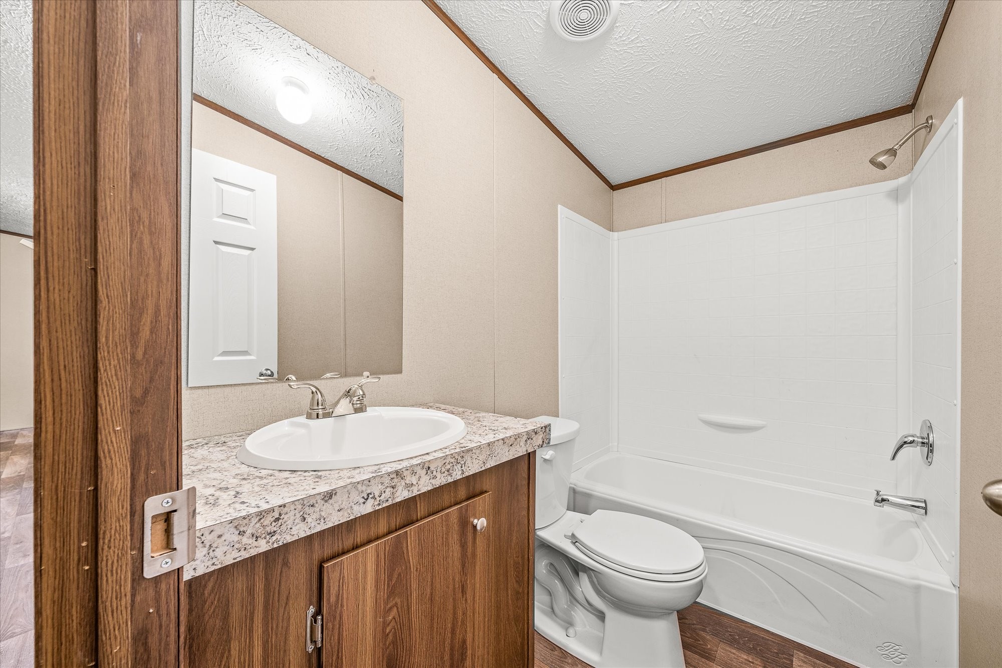 750 Maple Branch Road Sparta, TN 38583 - Photo 21 of 36 a bathroom with a granite countertop sink toilet and shower