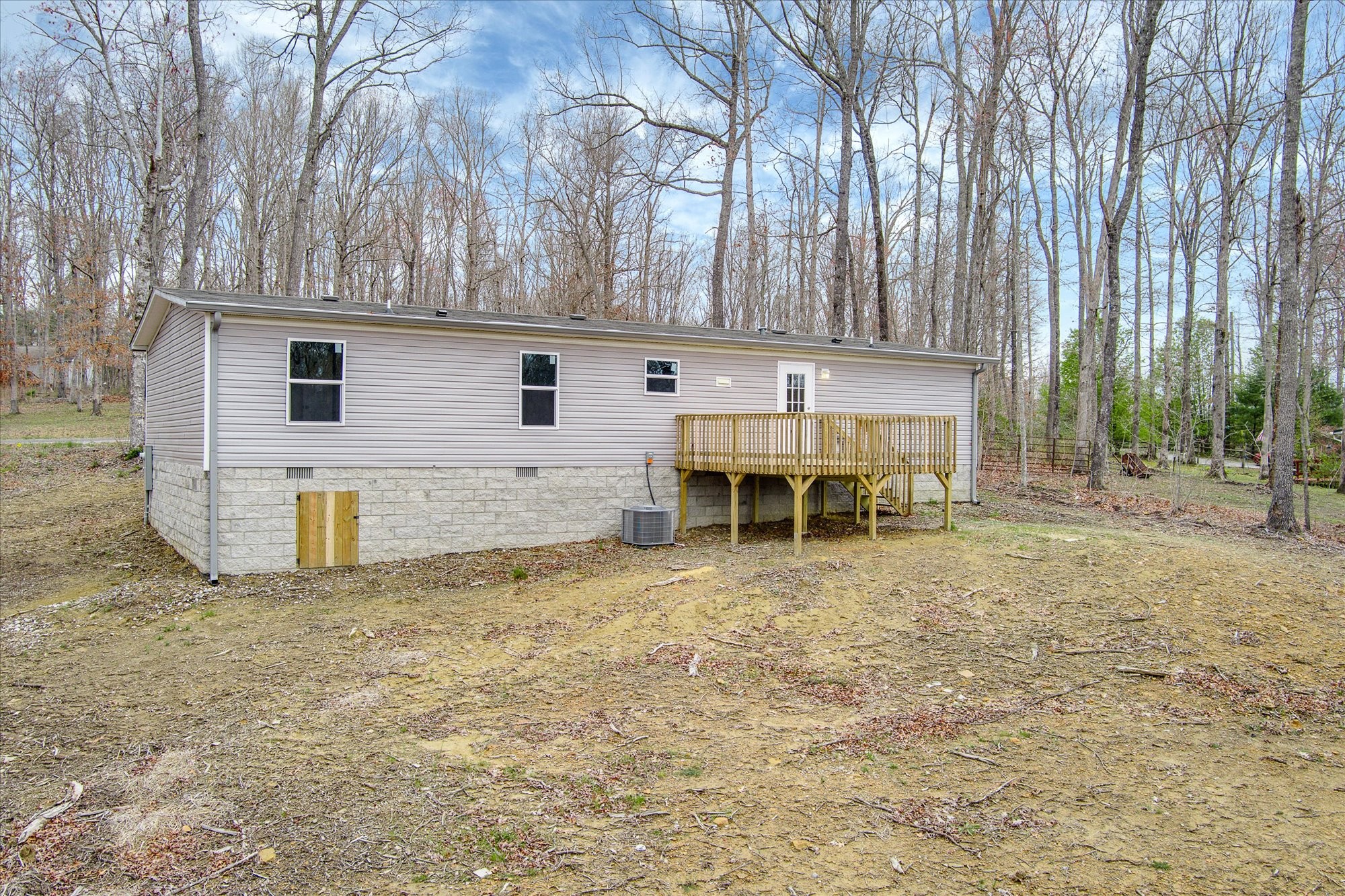 750 Maple Branch Road Sparta, TN 38583 - Photo 24 of 36 a backyard of a house with table and chairs