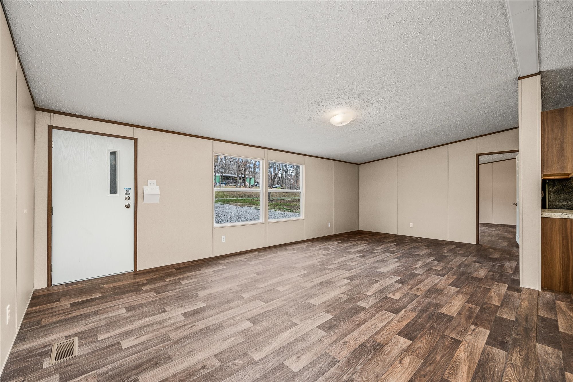750 Maple Branch Road Sparta, TN 38583 - Photo 8 of 36 a view of empty room with wooden floor and fan