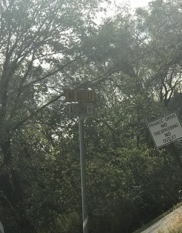 a view of a field with an outdoor space