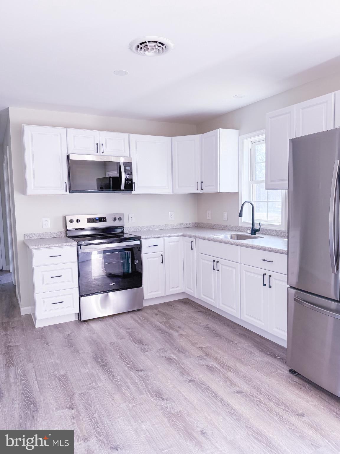 18558 Oak Road Bridgeville, DE 19933 - Photo 33 of 36 Modern kitchen with sleek finishes.
