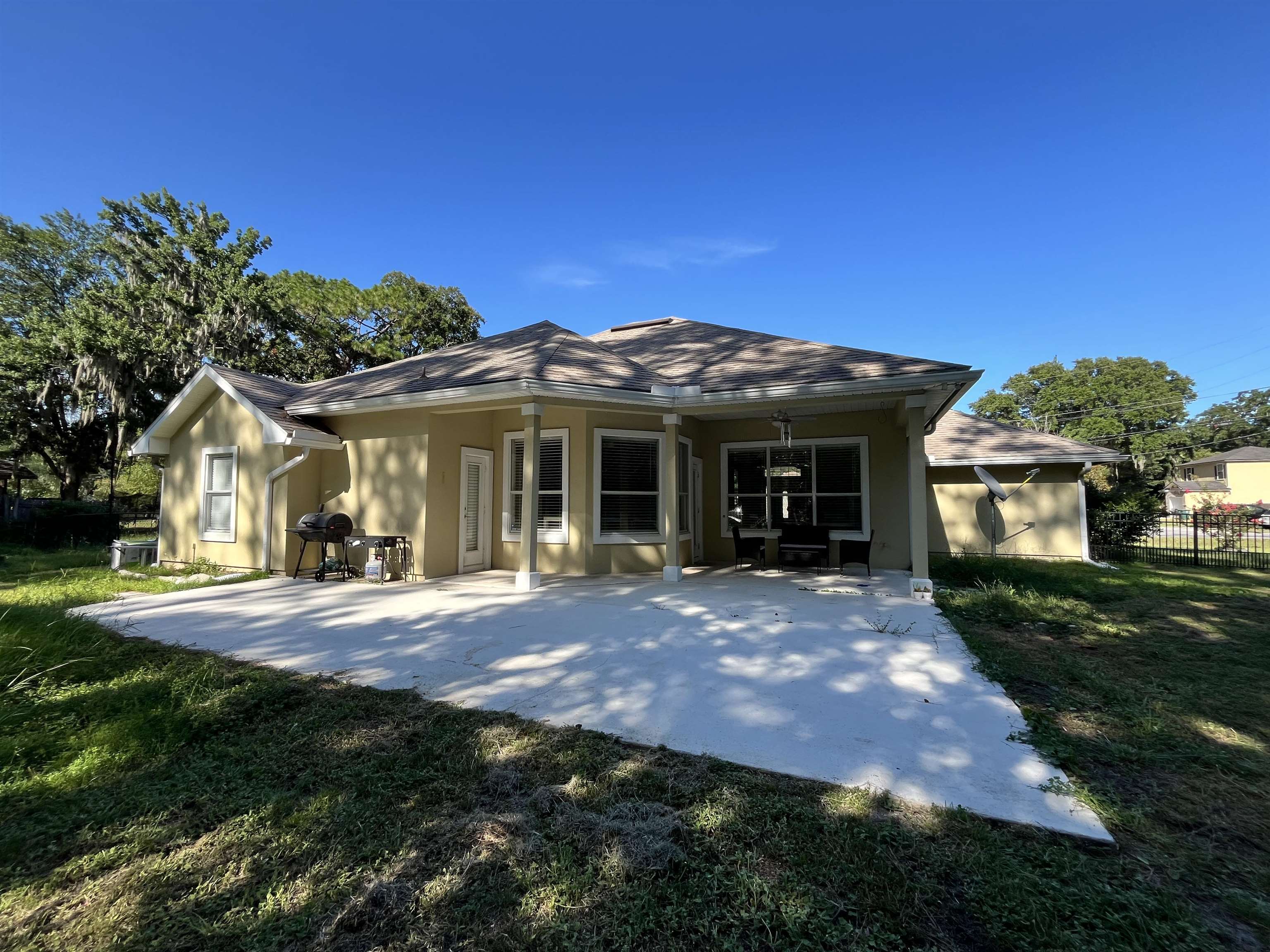9606 Melvina Road Jacksonville, FL 32257 - Photo 19 of 23 Rear view of house with a patio and stucco siding