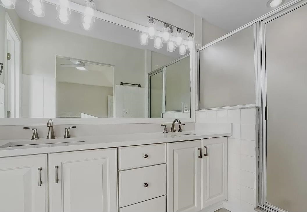 9606 Melvina Road Jacksonville, FL 32257 - Photo 7 of 23 Bathroom with double vanity and a ceiling fan