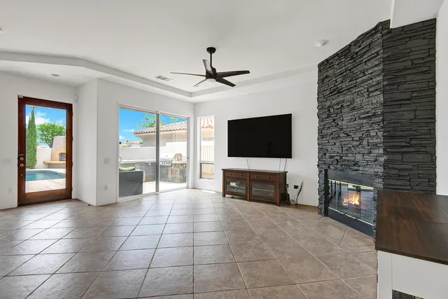 a view of living room with furniture and flat screen tv