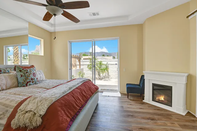 a spacious bedroom with a bed and a fireplace
