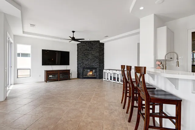 a view of a livingroom with furniture and a flat screen tv