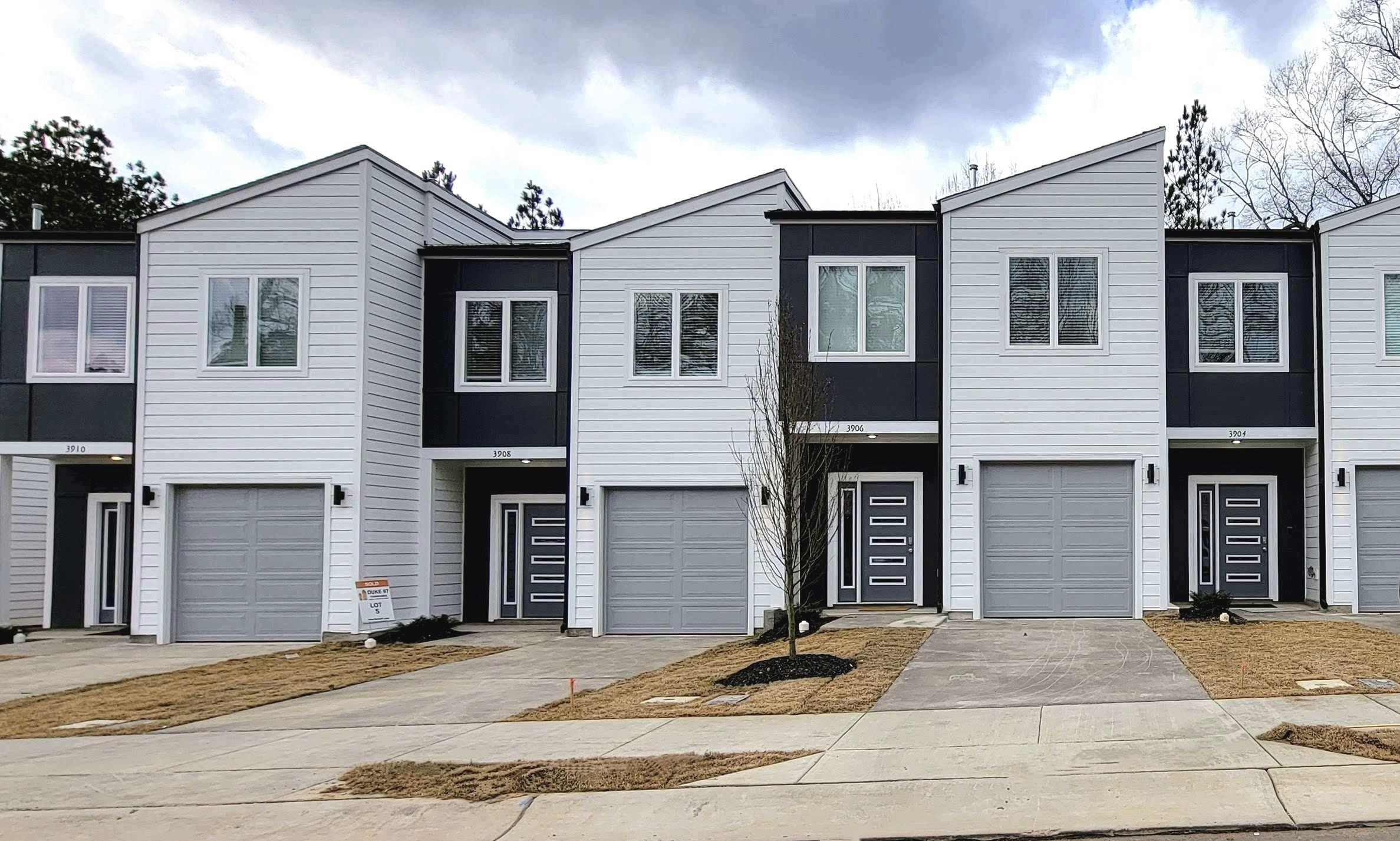1035 Nano Tech Circle Durham, NC 27704 - Photo 1 of 38 a front view of multiple houses