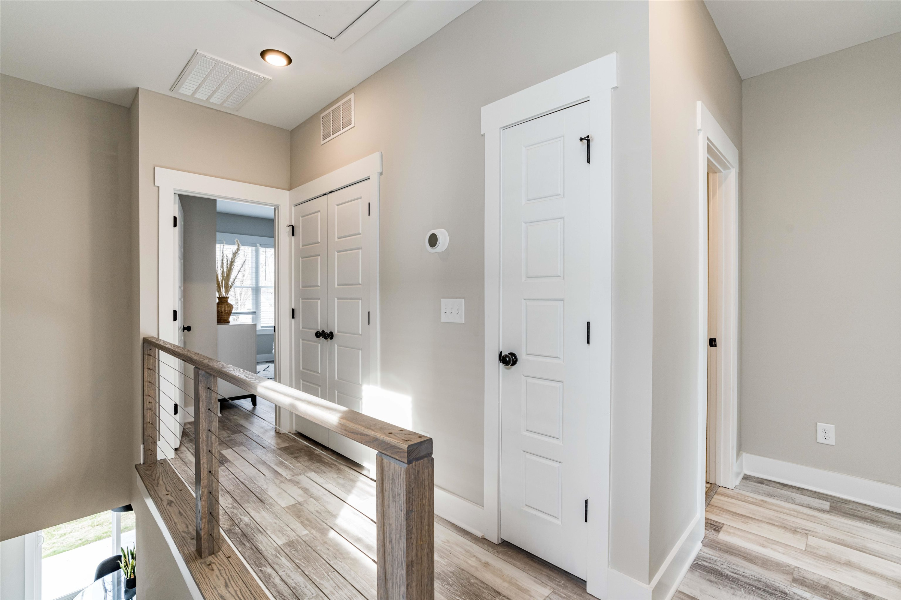 1035 Nano Tech Circle Durham, NC 27704 - Photo 18 of 38 a view of a hallway with wooden floor and staircase