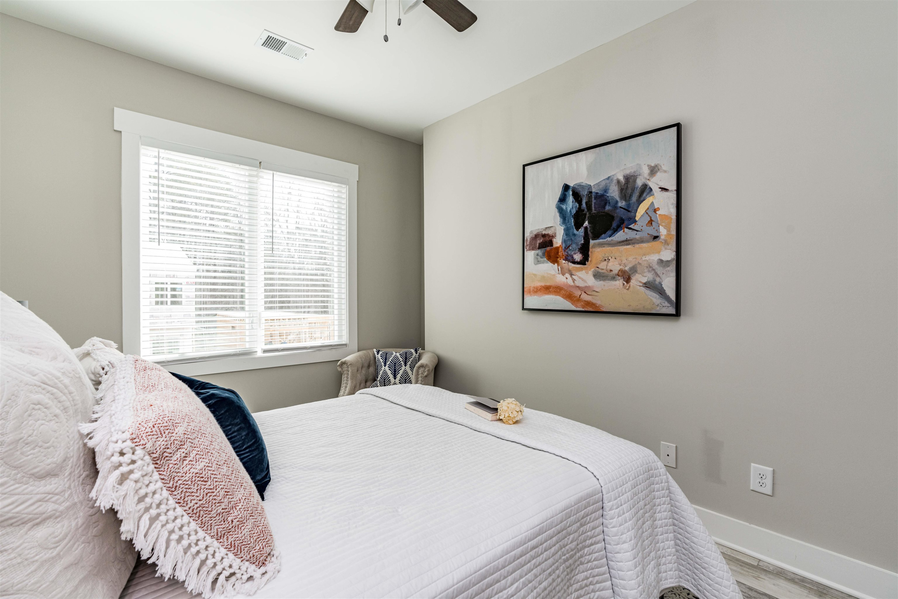 1035 Nano Tech Circle Durham, NC 27704 - Photo 25 of 38 a bedroom with a bed and a painting on the wall