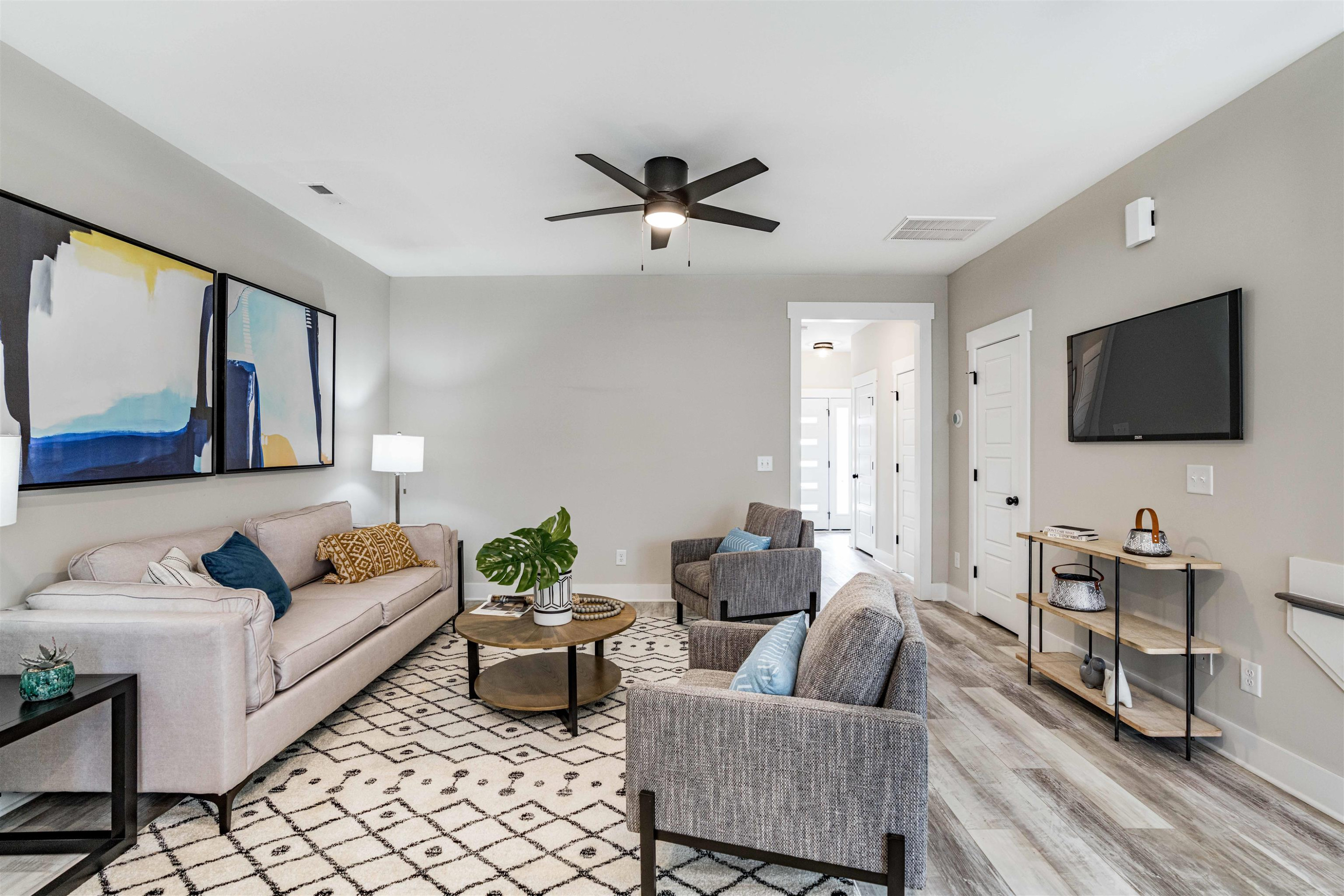 1035 Nano Tech Circle Durham, NC 27704 - Photo 8 of 38 a living room with furniture and a flat screen tv
