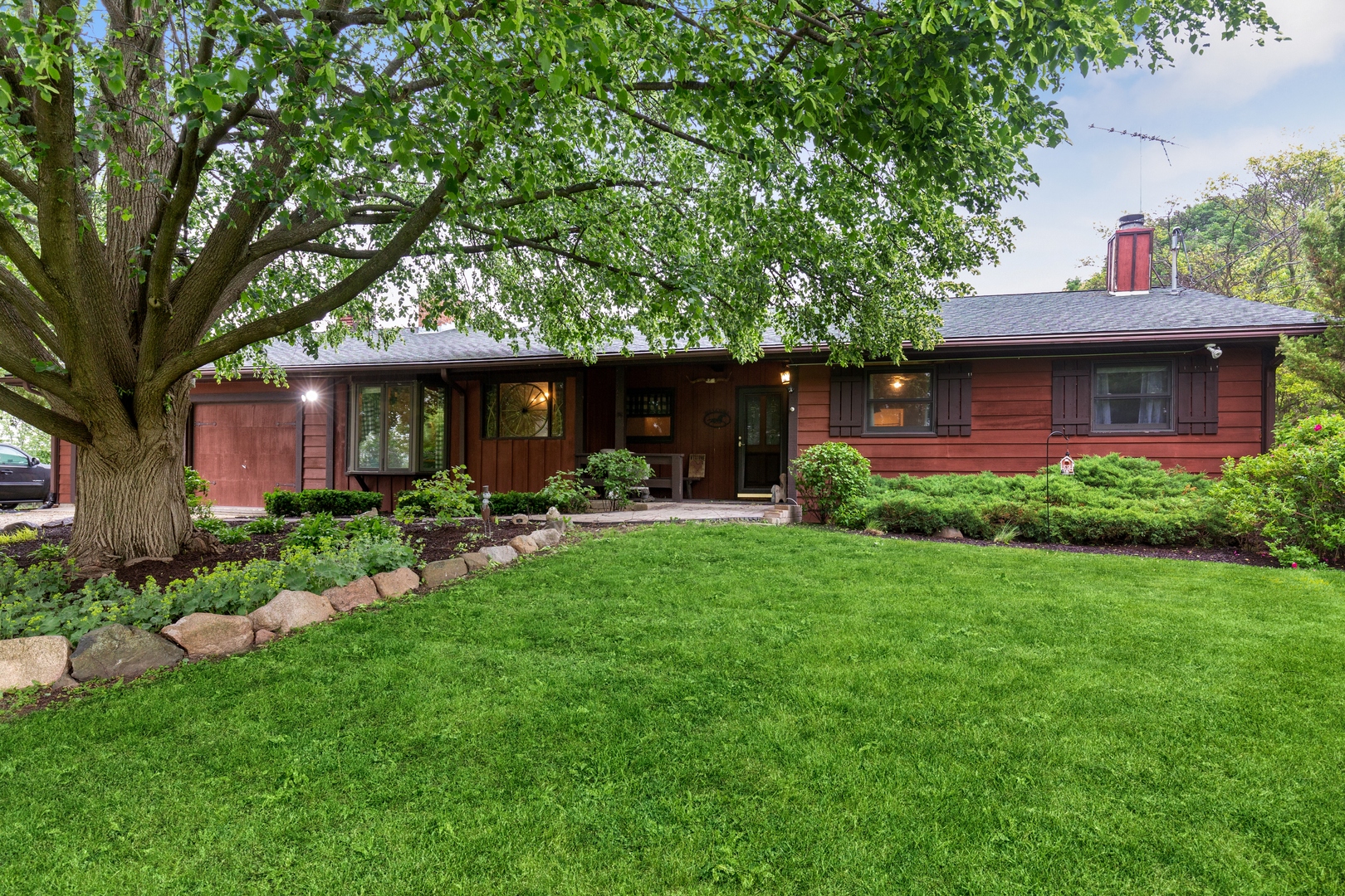 a front view of a house with garden