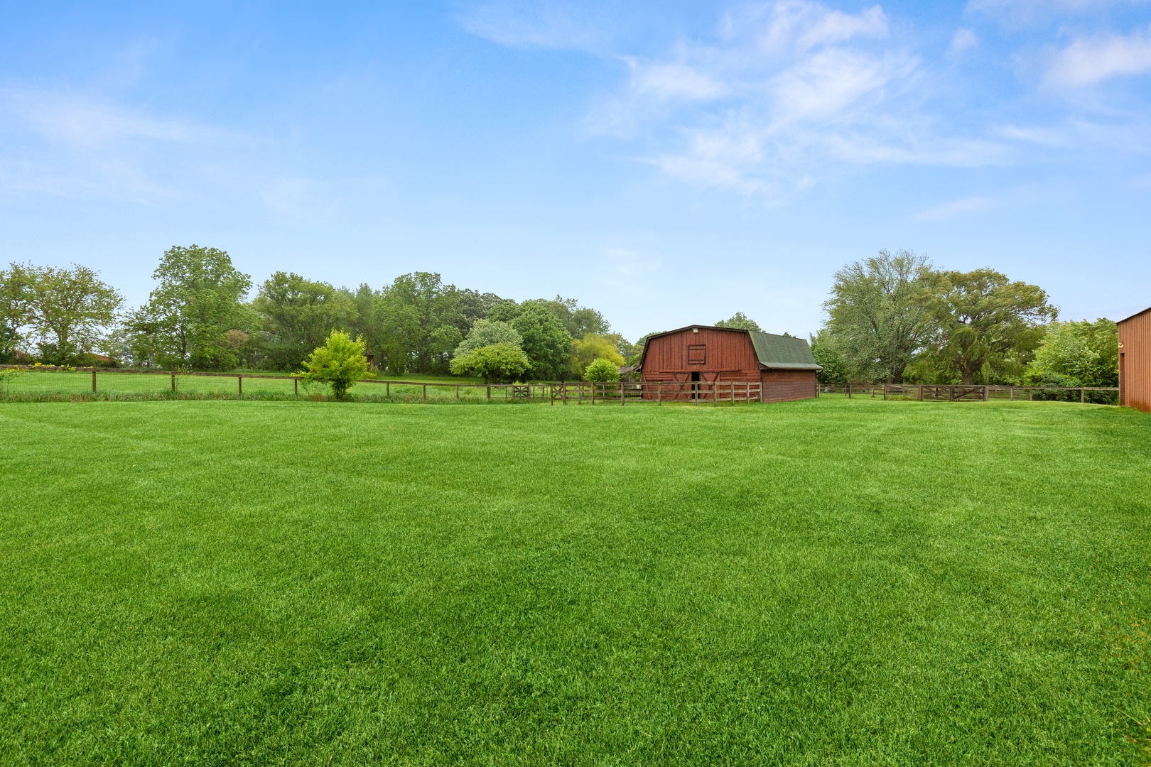 2563 Sheldon Road Grayslake, IL 60046 - Photo 21 of 36 a view of a grassy field with trees in the background