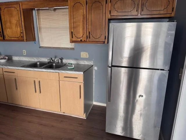 a white refrigerator freezer sitting inside of a kitchen