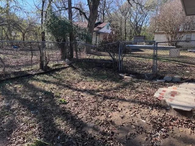 a view of backyard with trees