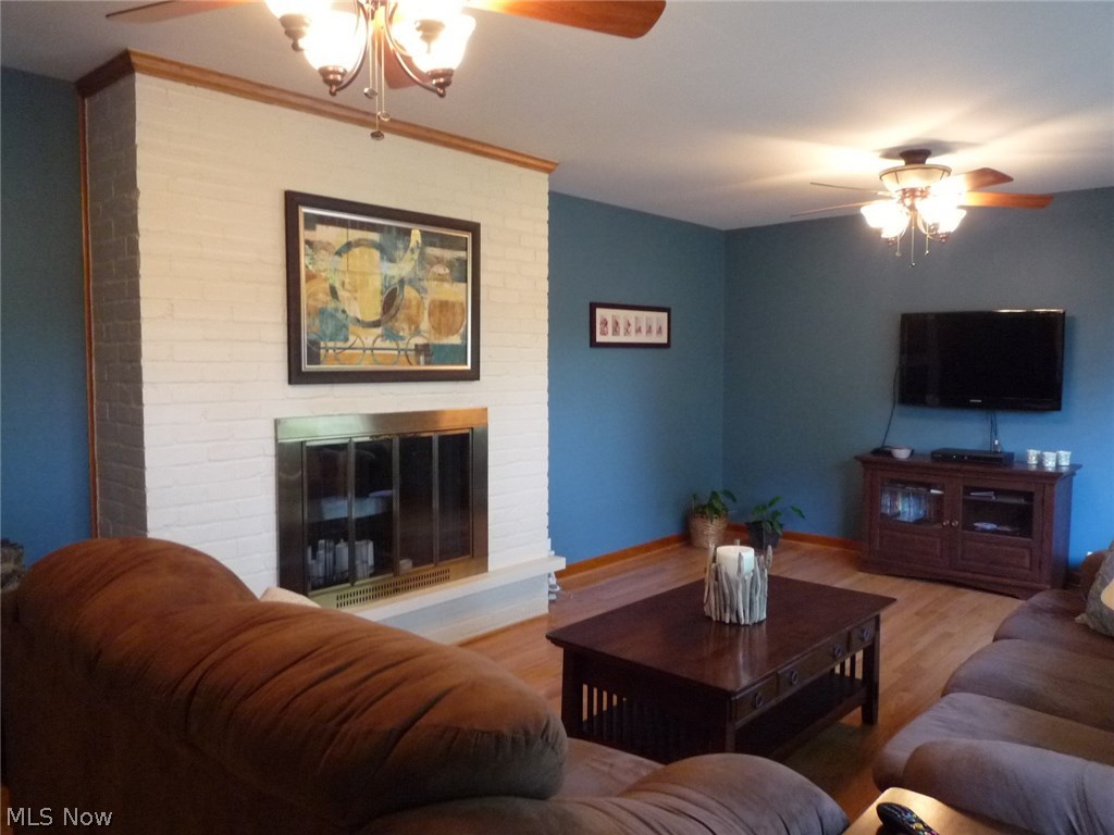 107 Robson Road Marietta, OH 45750 - Photo 2 of 31 Formal Living room with hardwood floors and wood burning fireplace.