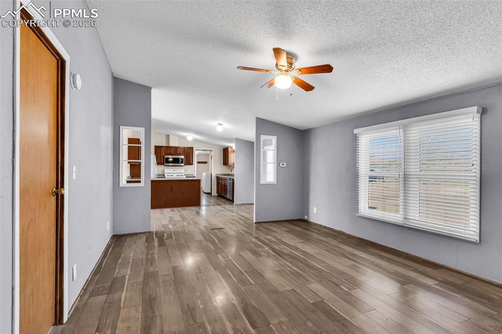1044 P Street Penrose, CO 81240 - Photo 19 of 48 a view of a kitchen with a dishwasher cabinets and wooden floor