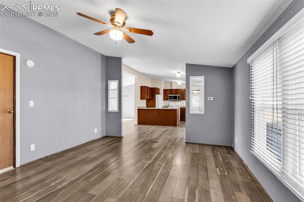 1044 P Street Penrose, CO 81240 - Photo 20 of 48 a view of large kitchen with wooden floor and a window