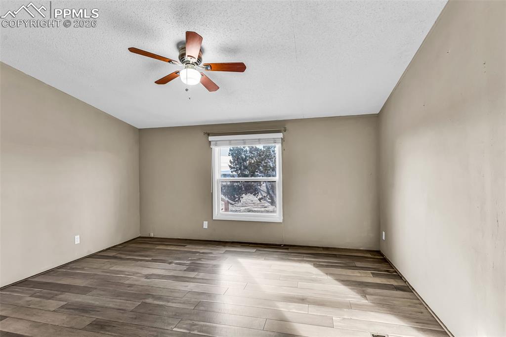 1044 P Street Penrose, CO 81240 - Photo 27 of 48 an empty room with window and ceiling fan
