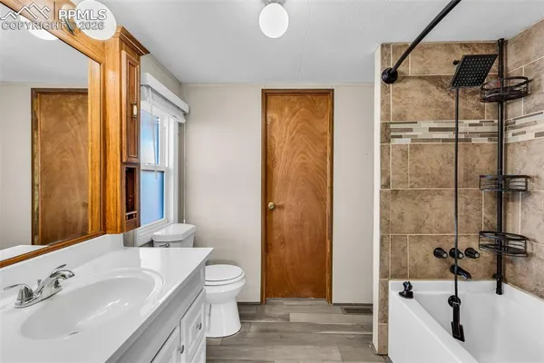 a utility room with a sink dryer and washer