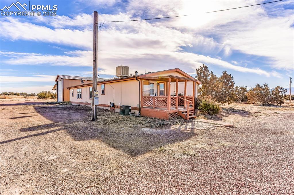 1044 P Street Penrose, CO 81240 - Photo 35 of 48 a view of a large tree with wooden fence